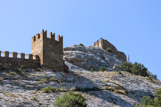 An ancient tower on a rock, the ruins of a castle