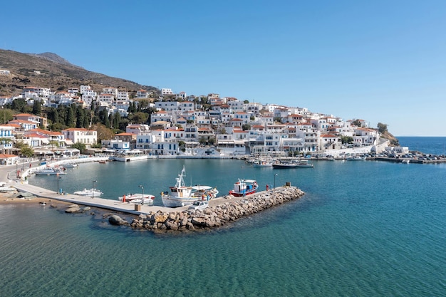 Andros island Batsi village Cyclades Greece View of traditional building port sea blue sky