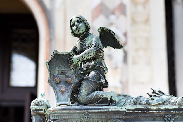 Angel holding a shield with Colleoni Coat of Arms as a decoration of the fence of Bergamo cathedral in Italy