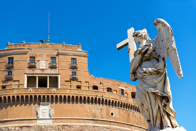 Angel statue on a bridge in front of the Castel SantAngelo Rome