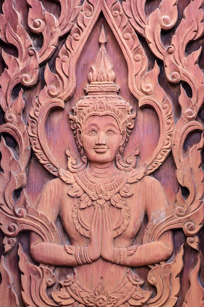 Angel in traditional Thai style wood carving