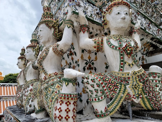 The angels carried the base of the Phra Prang Wat Arun Ratchawararam temple in Bangkok Thailand