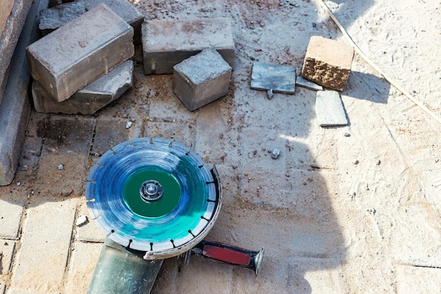 Angle grinder at a construction site Saw for cutting fittings Reinforced concrete foundation or grillage