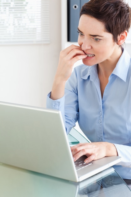 Angry businesswoman with a laptop