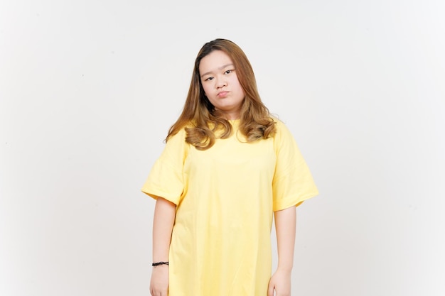 Angry Face Expression of Beautiful Asian Woman wearing yellow TShirt Isolated On White Background