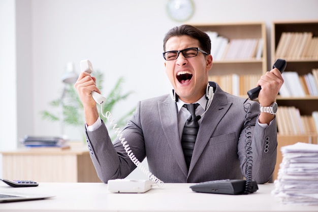 Angry helpdesk operator yelling in office