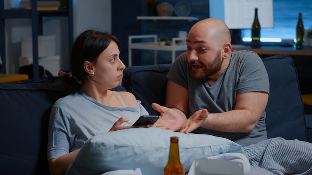 Angry husband and wife renters calculating household payments