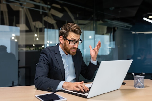 Angry mature boss got error laptop not turning on program not working senior man working on computer