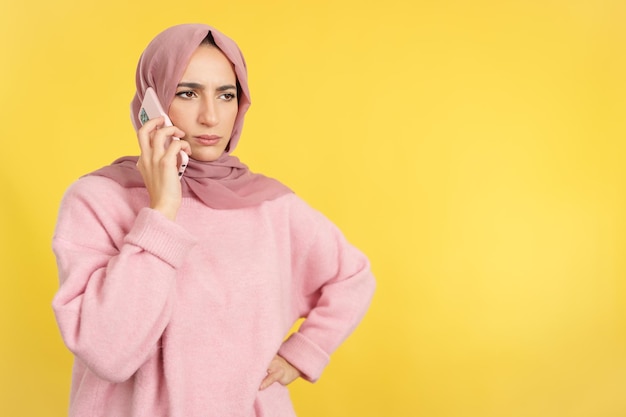 Angry muslim woman talking to the mobile