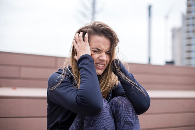 Angry young woman at outdoor