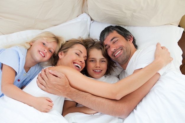 Animated family hugging in the bedroom