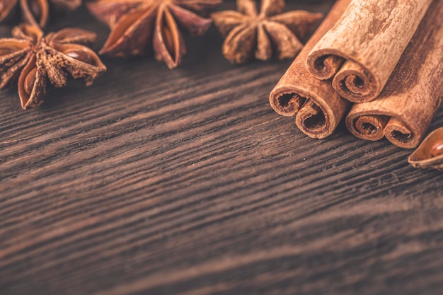 Anise and cinnamon on wooden table Copyspace Toned photo