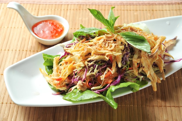 Annam Broccoli Shredded Chicken Salad with chilli sauce served in dish isolated on table green food