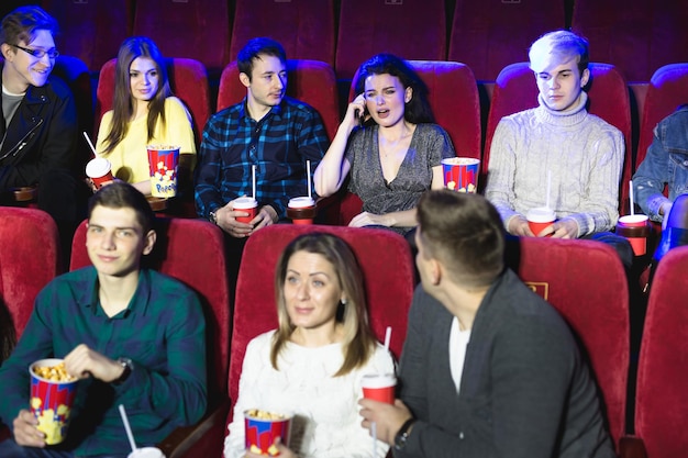 Annoying woman on the phone during movie at the cinema