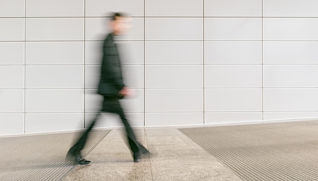 anonymous businessman walking in a floor, including copy space