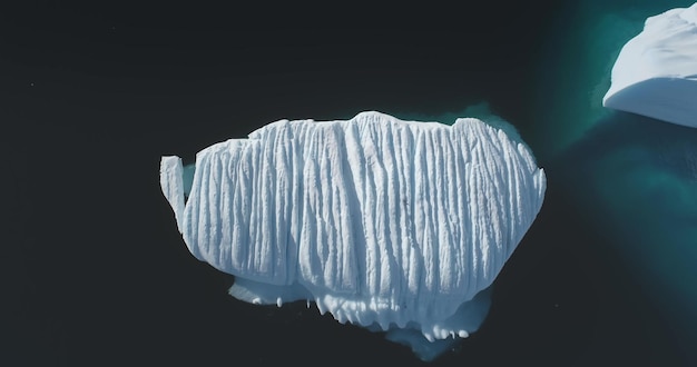 Photo antarctica big melting iceberg ocean seascape aerial view serene beauty of a glacier surrounded by