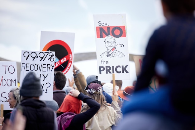 Anti vax protest and people with posters sign and fight for human right banner and freedom Support outdoor and group with march health issue and crowd in stress billboard and resistance