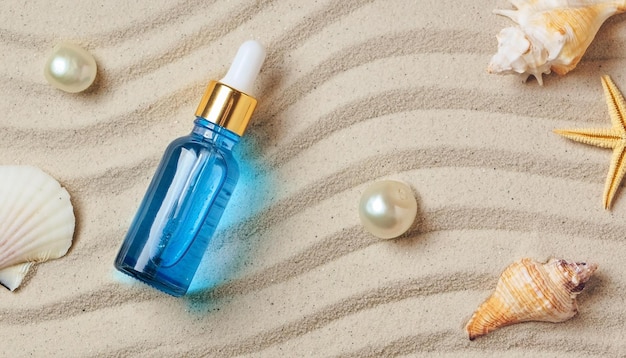 AntiAging Serum with Collagen and Peptides in Blue Glass Bottle on Smooth Sand