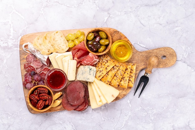 Antipasto board with prosciutto salami crackers cheese