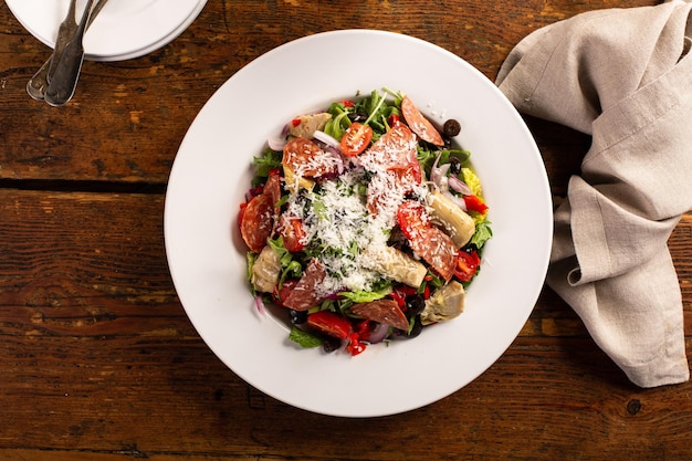 Antipasto salad with salami artichoke hearts and vegetables