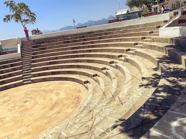 Antique amphitheater stadium for battles and performances in the ancient world steps and stairs