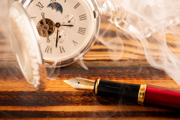 Antique clock and accessories old and beautiful clock and accessories on rustic wood and dark background selective focus