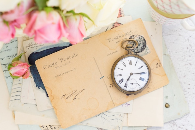 Antique clock and old mail