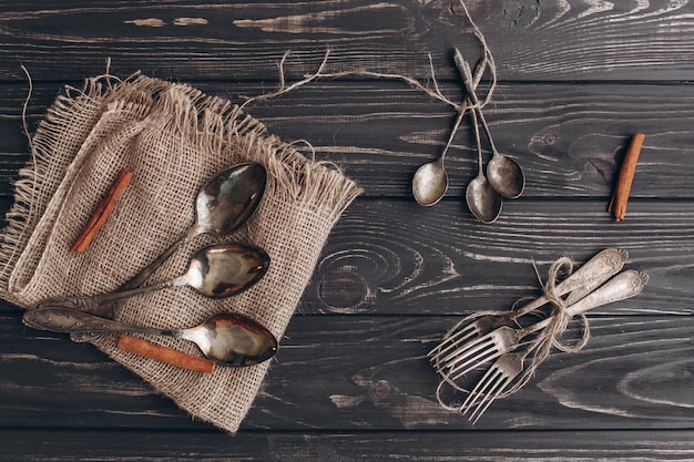 Photo antique cutlery.old silver spoons and forks on  wooden background