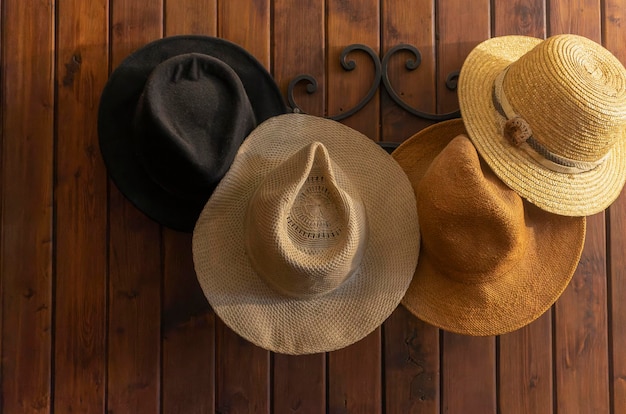 Antique hats hung on wall coat rack