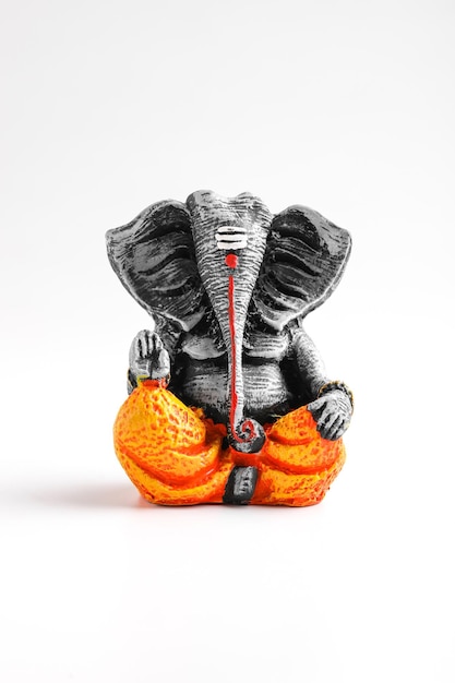 Antique lord ganesha sculpture on white background