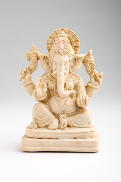 Antique lord ganesha sculpture on white background