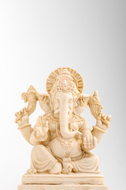 Antique lord ganesha sculpture on white background