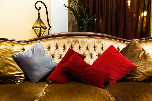 Antique sofa with pillows in the hotel living room