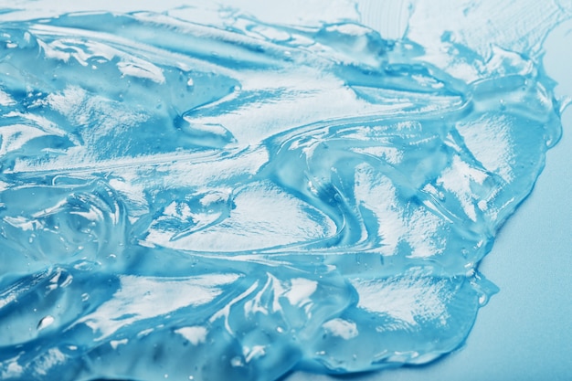 Antiseptic gel on a blue surface in waves