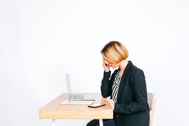 Anxious businesswoman at working place