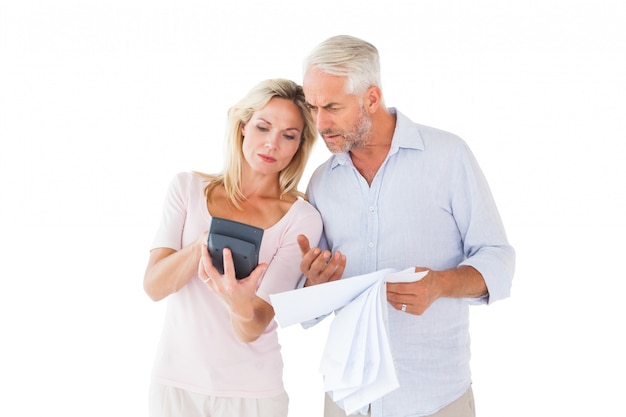 Anxious couple working out their bills