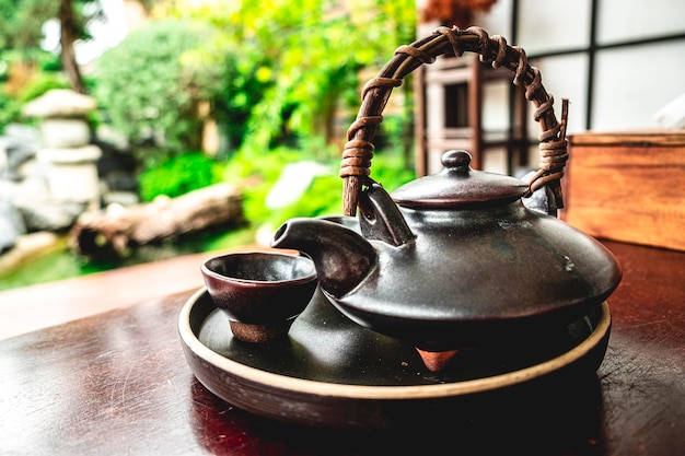 Apanese healthy green tea in a small cups and teapot over