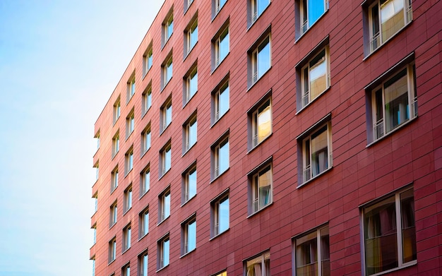 Apartment in residential building exterior. Housing structure at blue modern house of Europe. Rental home in city district on summer. Architecture for business property investment in Berlin, Germany.