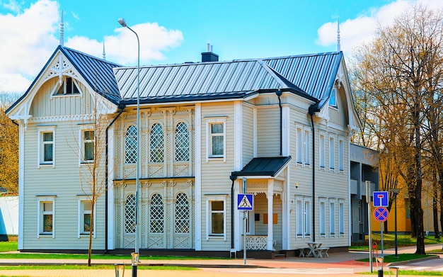 Apartment in residential building exterior. Housing structure at blue modern house of Europe. Rental home in city district on summer. Wall and glass high architecture for business property investment.