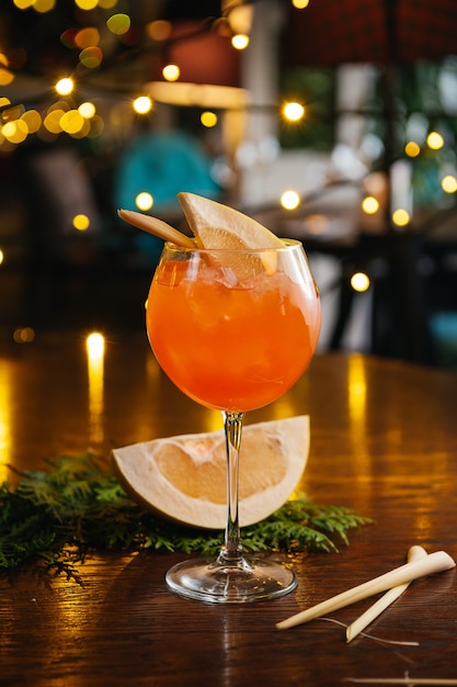 aperol spritz cocktail with pomelo on the table in restaurant