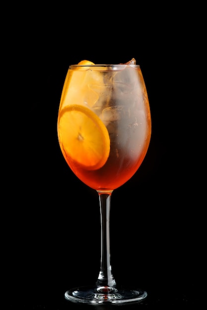 Aperol spritz cocktail with slice orange on black background. Cocktail on black background menu layout restaurant bar