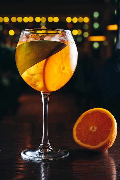 Aperol spritz in a glass with ice and orange