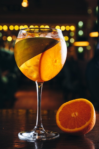 Aperol spritz in a glass with ice and orange