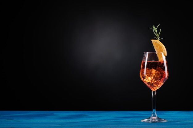 An Aperol Spritz with ice on the table