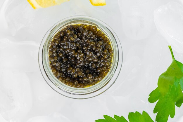 Appetizers of natural sturgeon black caviar lemon and parsley