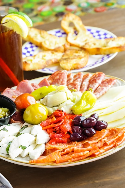 Appetizers plate with antipasto in Italian restaurant.