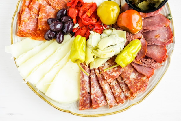 Appetizers plate with antipasto in Italian restaurant.