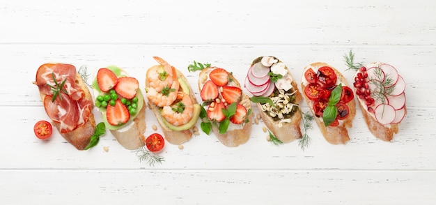 Appetizers plate with traditional spanish tapas set Italian antipasti brushetta snacks