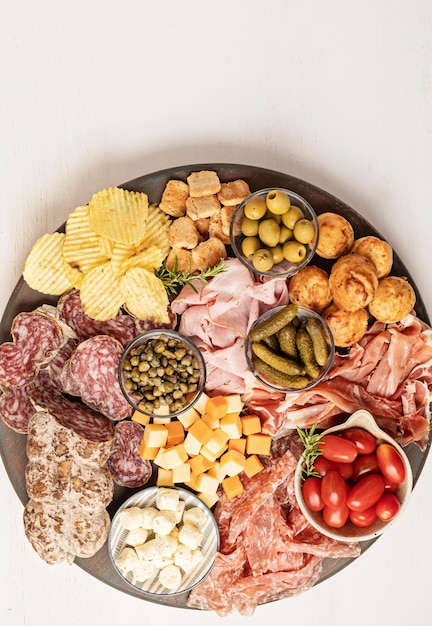 Appetizers table with different antipasti charcuterie snacks cheese