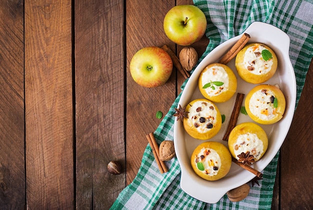 Appetizing baked apples with cottage cheese and raisins